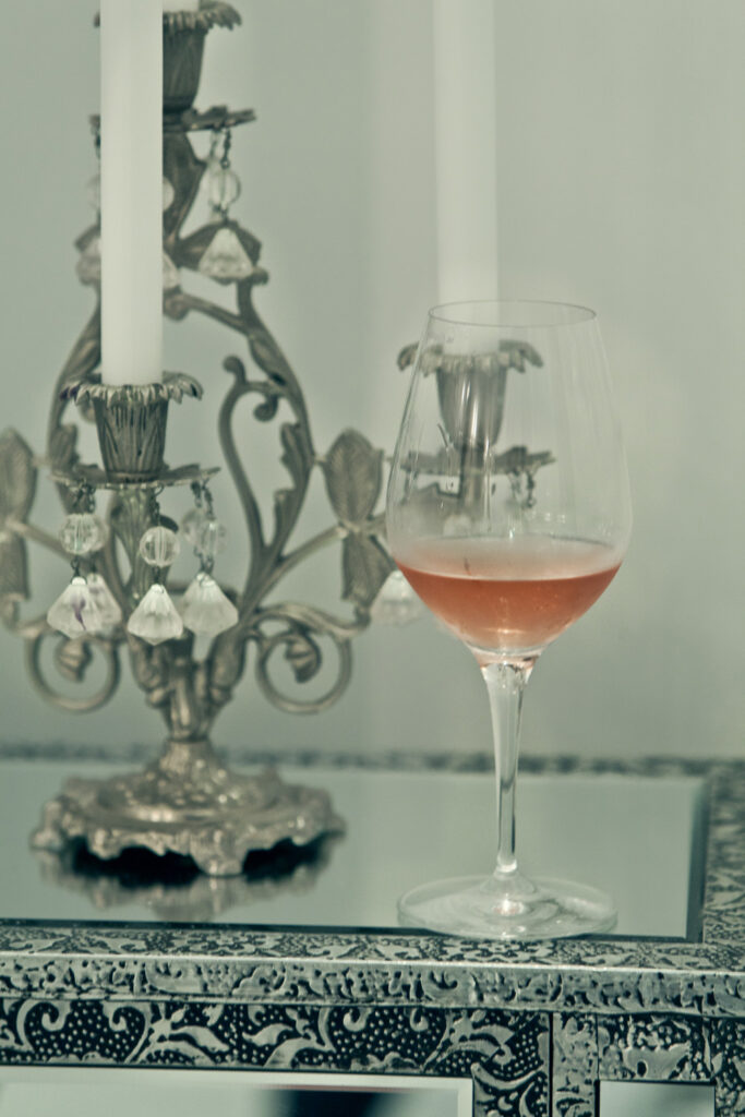 still life vino rose candelabro